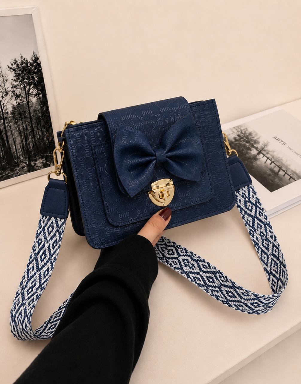 BOW LOCK CROSS-BODY BAG