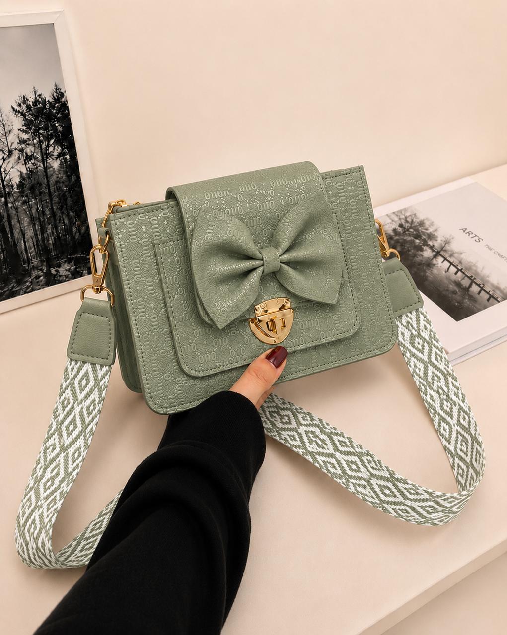 BOW LOCK CROSS-BODY BAG